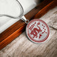 Elegant silver pendant necklace featuring a vivid red Dragon, set against a silver backdrop. This jewelry offers personalization with an engraving option for a name.