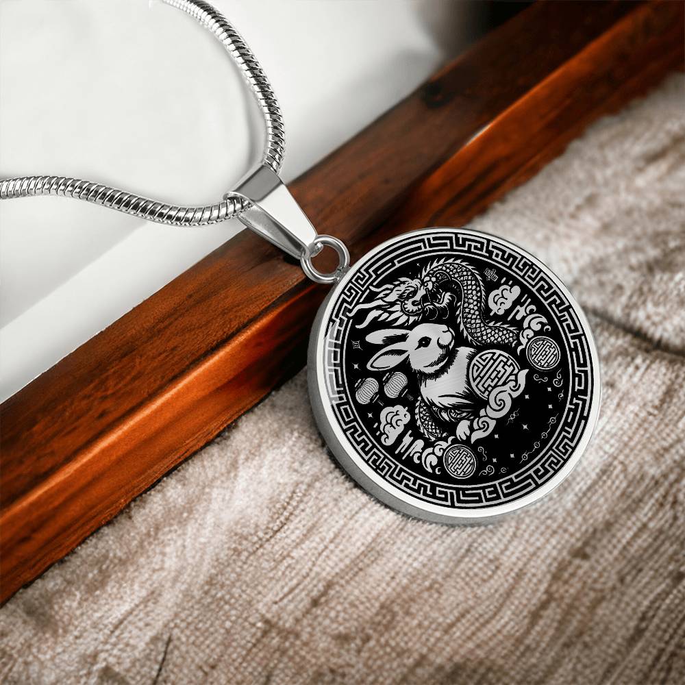 This Year of the dragon necklace. Elegant silver pendant with a rabbit & dragon, is set against a silver backdrop. This jewelry offers personalization with an engraving option for a name.