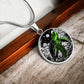 Elegant silver pendant featuring a vivid Green Turtle Necklace with a moon, Stars, Clouds and Ocean set against a black  backdrop. This jewelry offers personalization with an engraving option for a name.