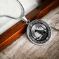 An Elegant silver pendant Celtic Wolf necklace With a silver and Black background. This jewelry offers personalization with an engraving option for a name.