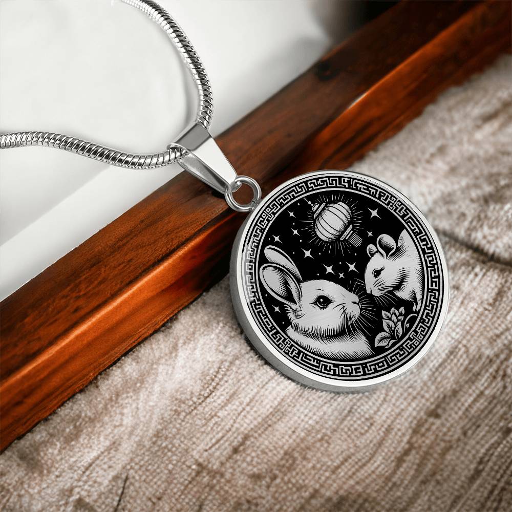 An Elegant silver pendant featuring a Year of the Rat and Year of The Rabbit Necklace in silver and black. This jewelry offers personalization with an engraving option for a name.