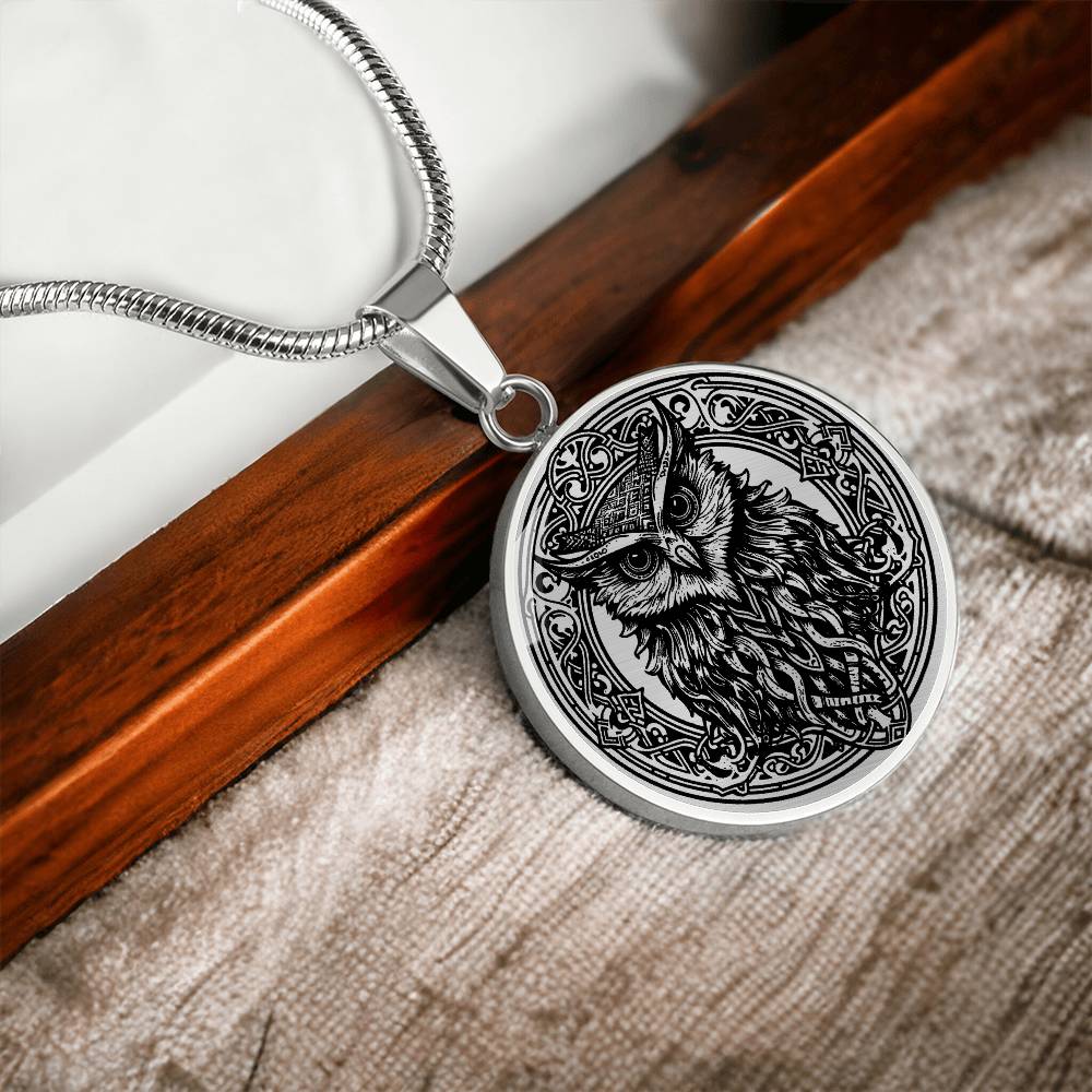 an Elegant silver pendant Celtic Owl necklace featuring a vivid Celtic black owl inside a circle frame with a silver backdrop. This jewelry offers personalization with an engraving option for a name.