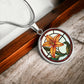 Elegant Silver pendant necklaces features an Orange Tiger Lily, Green Grass, white background with a red and brown frame. This necklace offers personalization with an engraving option for a name.