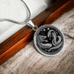 An Elegant silver pendant featuring a Year of the Snake and Year of The Dragon Necklace in silver and black. This jewelry offers personalization with an engraving option for a name.