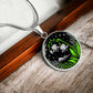 An Elegant silver pendant Lily Of The Valley Necklace featuring Green Grass, Silver Mountains, Stars,  Lily Of The Valleys with a black backdrop. This jewelry offers personalization with an engraving option for a name.