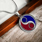 Elegant silver pendant featuring a vivid Fire red & Water blue Celtic Yin Yang Necklace set against a silver & Black backdrop. This jewelry offers personalization with an engraving option for a name.