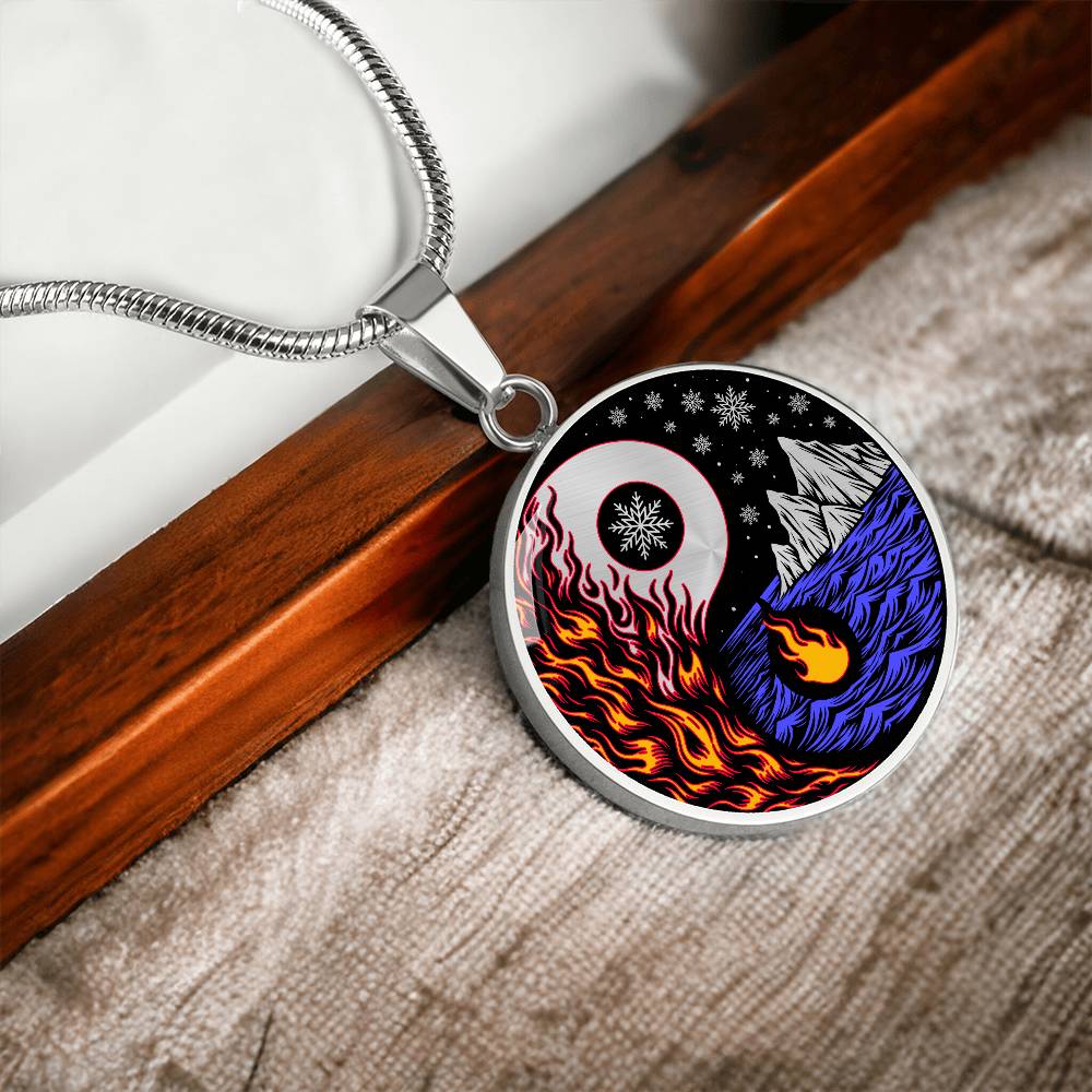 Elegant silver pendant featuring a vivid Red/Orange Fire, Blue Water, Silver snow flakes and Silver Icebergs. set against a silver & Black backdrop. This jewelry offers personalization with an engraving option for a name.