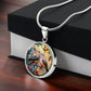 Gift box with an Elegant silver pendant necklace featuring two turtle doves, set against a subtle tan backdrop. This jewelry offers personalization with an engraving option for a name.