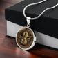 Gift box with an elegant silver pendant Violet Necklace. The colors are brown, black and tan. This jewelry offers personalization with an engraving option for a name.