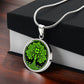 Gift box with an Elegant Silver pendant featuring a vivid Green Celtic four leaf Clover Tree of Life Necklace, set against a Black & silver backdrop. This jewelry offers personalization with an engraving option for a name.