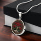 Gift box with an elegant silver pendant Rose Tree of Life Necklace. The Colors are red, green, white and black. This jewelry offers personalization with an engraving option for a name.
