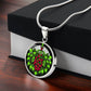 Gift box with an Elegant silver pendant necklace featuring a vivid Mistletoe with red berries set against a silver & black backdrop. This necklace offers personalization with an engraving option for a name.