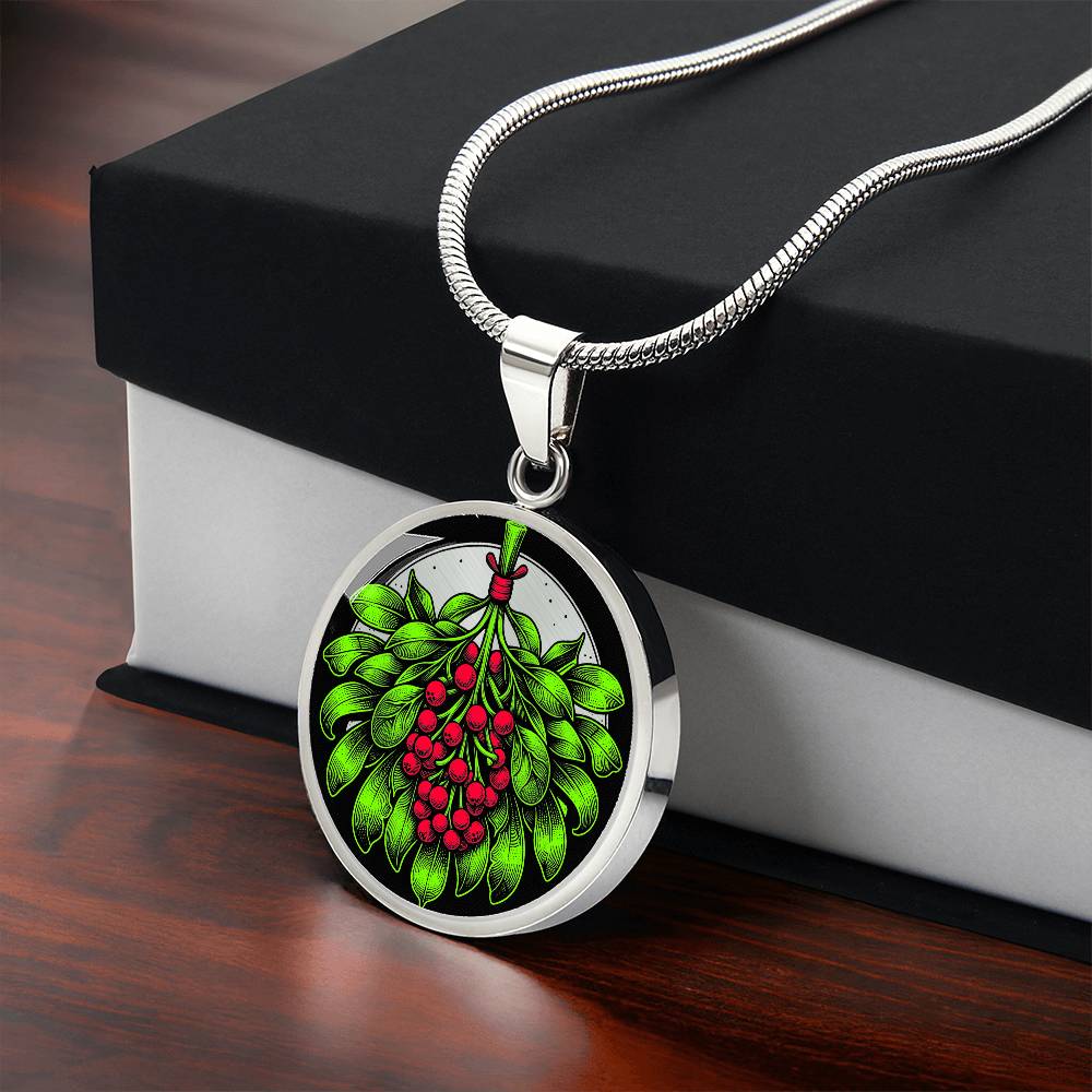 Gift box with an Elegant silver pendant necklace featuring a vivid Mistletoe with red berries set against a silver & black backdrop. This necklace offers personalization with an engraving option for a name.