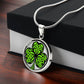 Gift box with an Elegant silver pendant necklace featuring a vivid Green Celtic Clover set against a silver & black backdrop. This necklace offers personalization with an engraving option for a name.