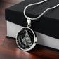Gift box with an elegant silver pendant Crow Necklace. The colors are gold and black. This jewelry offers personalization with an engraving option for a name.