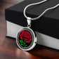 Gift box with an elegant Celtic silver pendant January Birth Flower Carnation necklace. A vivid red carnation, green stem & leaves, set against a silver & black backdrop. This jewelry offers personalization with an engraving option for a name.