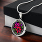 Giftbox with an Elegant silver pendant featuring a vivid red, Pink & Purple honeysuckles, Junes birth month flower, set against a black backdrop with the metal shinning through. This necklace offers personalization with an engraving option for a name