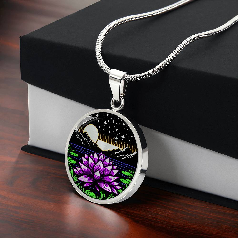 Gift box with An Elegant silver pendant Water Lily Necklace featuring Mountains, Stars, Yellow outline Sun, Green grass Lily Pads, Blue Water, Pink lily, black and silver Background. This jewelry offers personalization engraving option for a name.