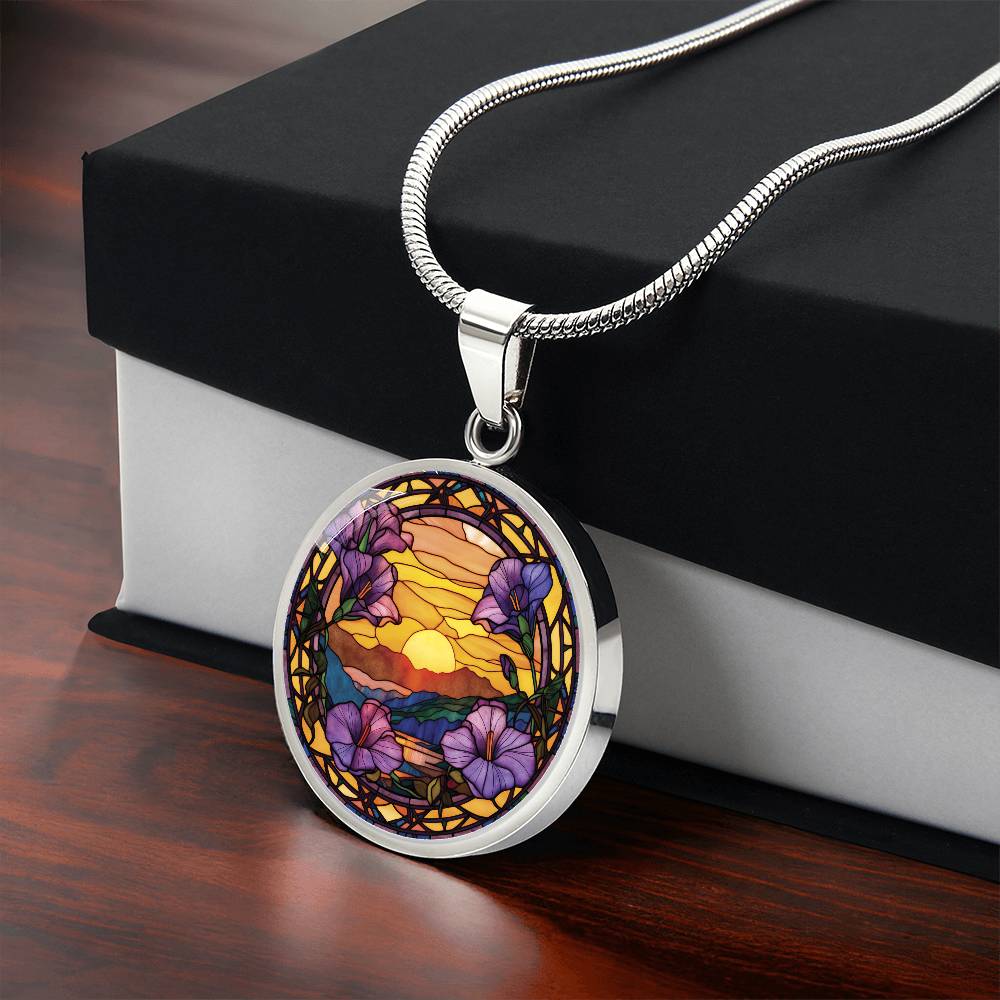 Gift box with an elegant silver pendant Morning Glory Necklace. The colors are purple flowers, blue/green/purple hills, Brown mountains, Yellow sun and sky. This jewelry offers personalization with an engraving option for a name.