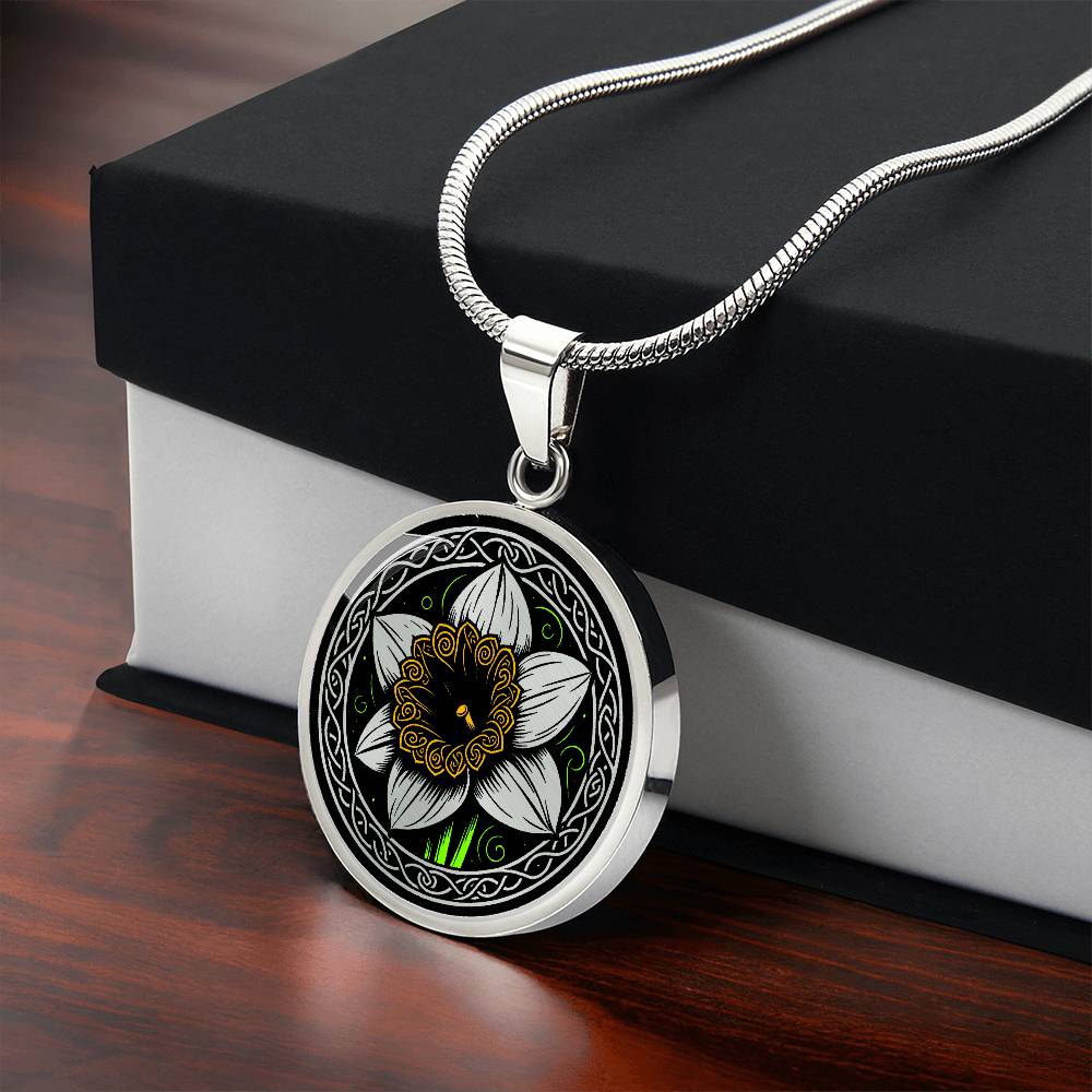 Gift box with an Elegant silver pendant featuring a vivid Yellow Daffodil Birth Flower Necklace, March birth month flower, set against a Green & Black backdrop with a Celtic border. Personalization with an engraving option for a name.