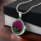 Gift box with an Elegant January Silver pendant Celtic Carnation Birth Flower necklace featuring a vivid pink, green flower, set against a Silver & black backdrop. This jewelry offers personalization with an engraving option for a name.