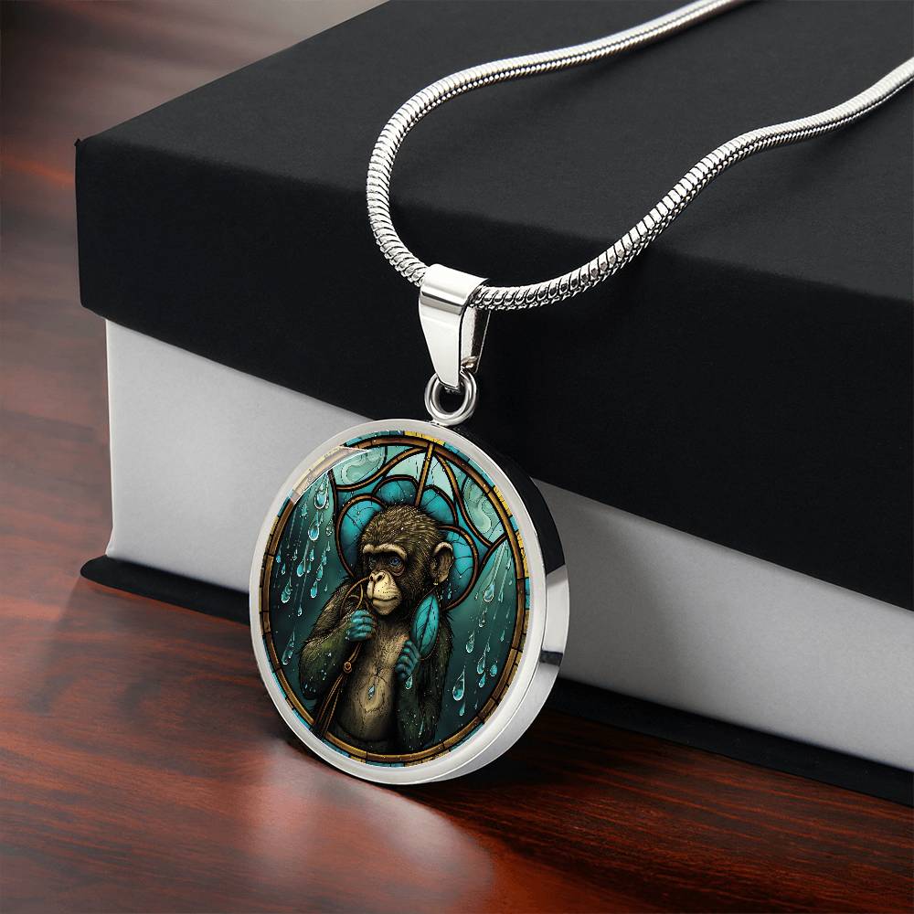 Giftbox with an elegant silver pendant Chinese Zodiac Monkey Necklace. The colors are yellow, blue, teal, brown and green. This jewelry offers personalization with an engraving option for a name.