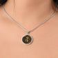 Woman wearing an elegant silver pendant Violet Necklace. The colors are brown, black and tan. This jewelry offers personalization with an engraving option for a name.
