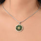 Woman Wearing an Elegant silver pendant Weed Leaf necklace featuring a Green and Gold Marijuana Leaf. This jewelry offers personalization with an engraving option for a name.