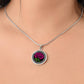 Woman wearing an Elegant January Silver pendant Celtic Birth Flower Carnation Necklace. Featuring a vivid pink flower with green leaves, set against a Silver & black backdrop. This jewelry offers personalization with an engraving option for a name.