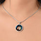 Woman wearing an elegant silver pendant Wood Rabbit Necklace. The Colors are brown, white, green, blue, yellow and red. This jewelry offers personalization with an engraving option for a name.