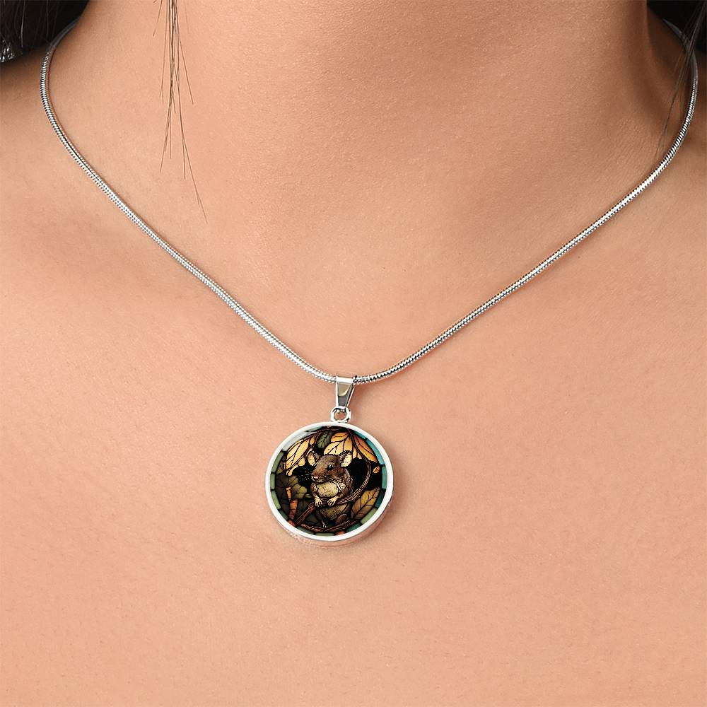 Woman wearing an Elegant silver pendant Rat necklace. Brown Rat, Brown Twigs, yellow and green leaves, blue, orange and green border. This jewelry offers personalization with an engraving option for a name.