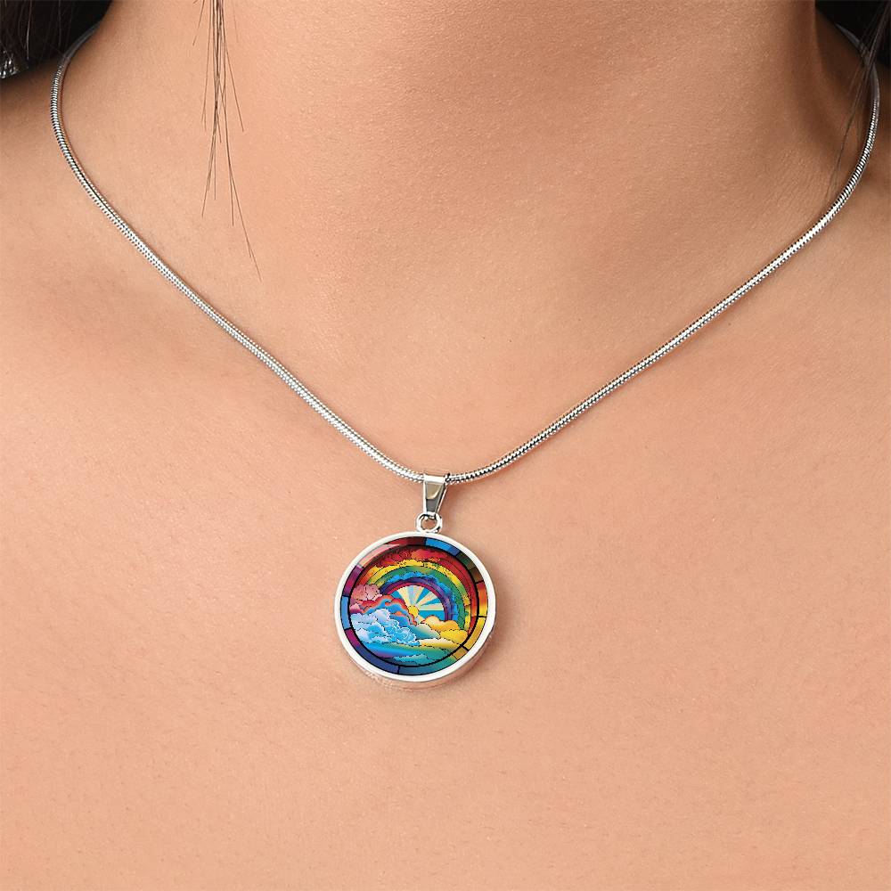 Woman wearing an elegant silver pendant Lucky Rainbow Necklace. The colors are all the colors of the rainbow. This jewelry offers personalization with an engraving option for a name.