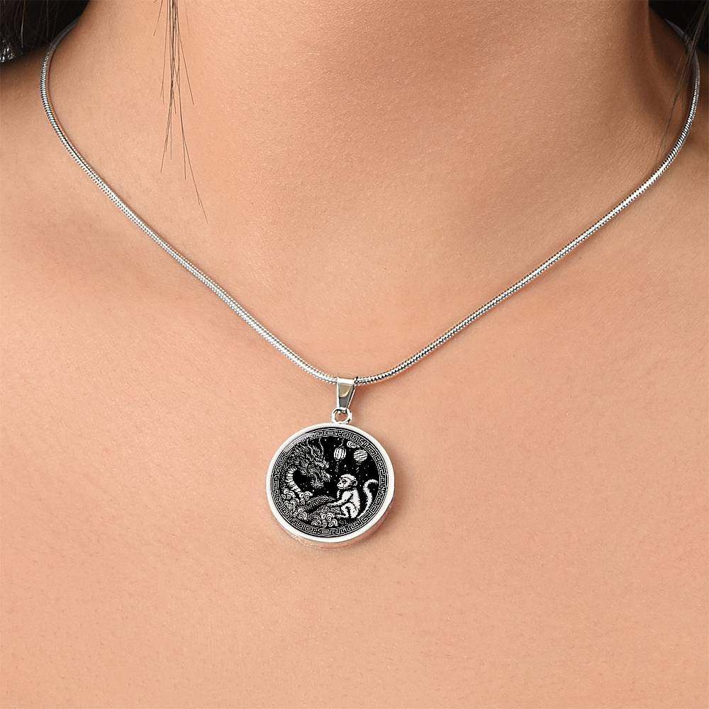 Woman wearing An Elegant silver pendant featuring a Year of the Monkey and Year of The Dragon Necklace in silver and black. This jewelry offers personalization with an engraving option for a name.