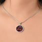 Woman wearing An Elegant silver pendant featuring a Year of the Snake and Year of The Dragon Necklace in red, yellow, silver and black. This jewelry offers personalization with an engraving option for a name.