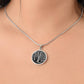 Woman wearing An Elegant silver pendant featuring a vivid silver Birch Tree Necklace, set against a Black backdrop. This jewelry offers personalization with an engraving option for a name.