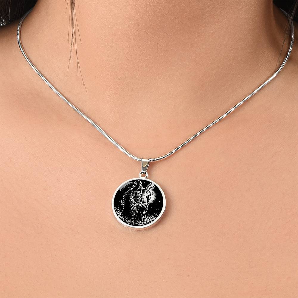 Woman wearing An Elegant silver pendant featuring a Fantasy Wizard Necklace in silver and black. This jewelry offers personalization with an engraving option for a name.