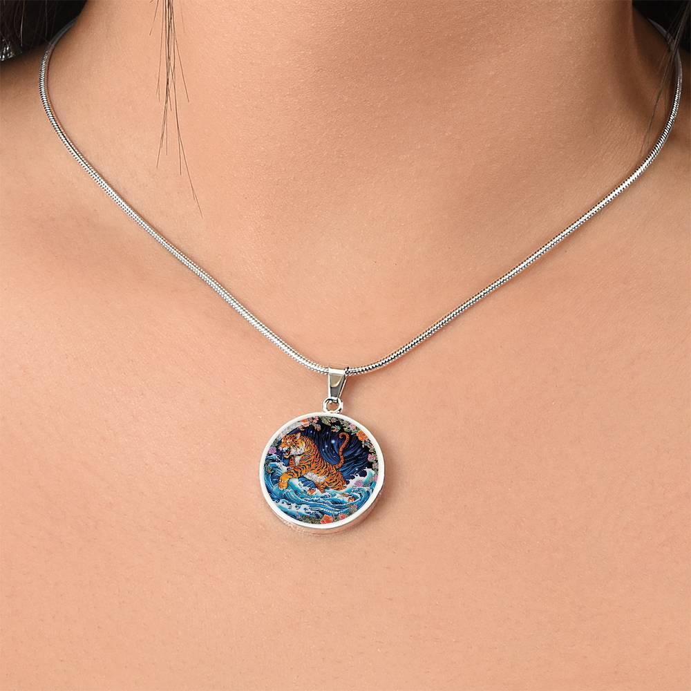 Woman wearing an elegant silver pendant Chinese Zodiac Tiger Necklace. The colors are blue, black, green, orange, white, pink, purple and red. This jewelry offers personalization with an engraving option for a name.