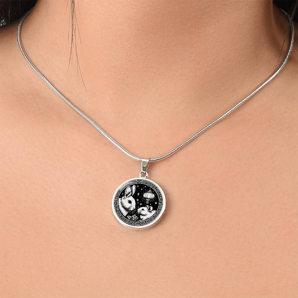 Woman wearing An Elegant silver pendant featuring a Year of the Rat and Year of The Rabbit Necklace in silver and black. This jewelry offers personalization with an engraving option for a name.