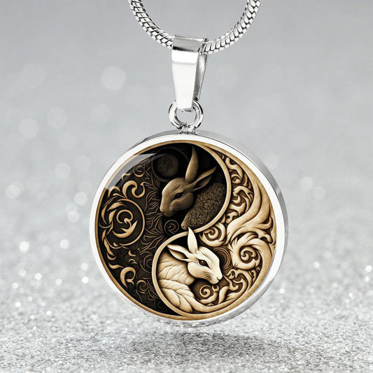 an Elegant silver pendant Yin Yang Rabbit Necklace. The Colors are Black, White and Tan. This jewelry offers personalization with an engraving option for a name.