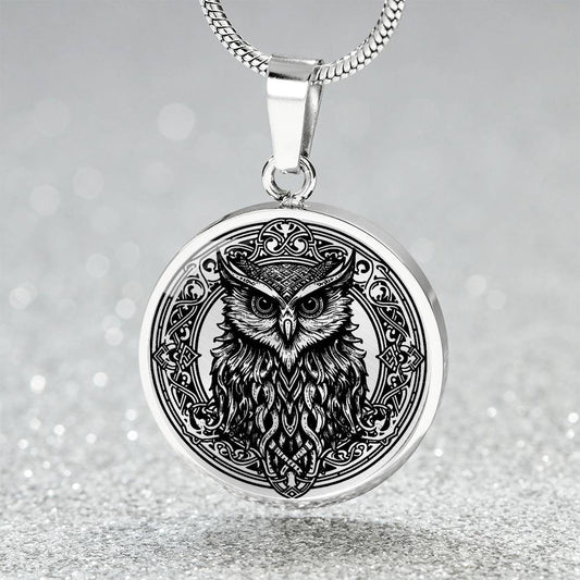 an Elegant silver pendant Celtic Owl necklace featuring a vivid Celtic black owl inside a circle frame with a silver backdrop. This jewelry offers personalization with an engraving option for a name.