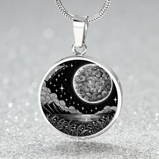 An Elegant silver pendant Moon Necklace. Featuring a Moon, water, mountains and clouds all in silver with a black background. This jewelry offers personalization with an engraving option for a name.