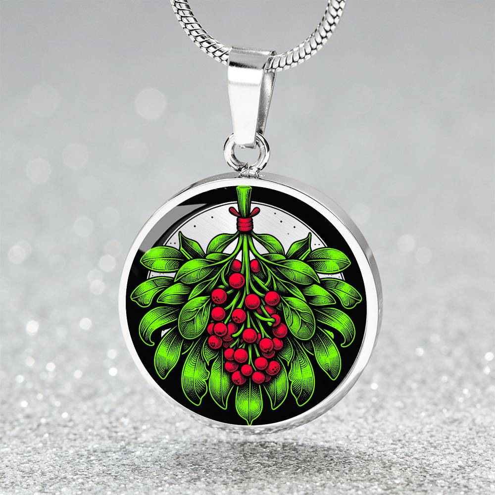 Elegant silver pendant necklace featuring a vivid Mistletoe with red berries set against a silver & black backdrop. This necklace offers personalization with an engraving option for a name.