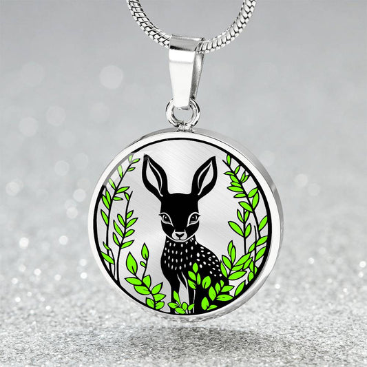 An Elegant silver pendant Deer Necklace. All in Silver and black with green leaves. This jewelry offers personalization with an engraving option for a name.