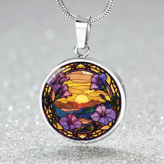 an elegant silver pendant Morning Glory Necklace. The colors are purple flowers, blue/green/purple hills, Brown mountains, Yellow sun and sky. This jewelry offers personalization with an engraving option for a name.