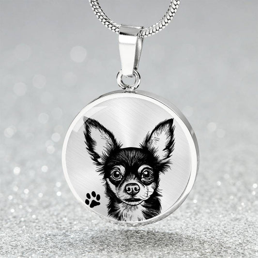 An Elegant silver pendant Chihuahua Dog Necklace. The Chihuahua Design is in Silver and Black with a black paw print. This jewelry offers personalization with an engraving option for a name.