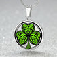 Elegant silver pendant necklace featuring a vivid Green Celtic Clover set against a silver & black backdrop. This necklace offers personalization with an engraving option for a name.