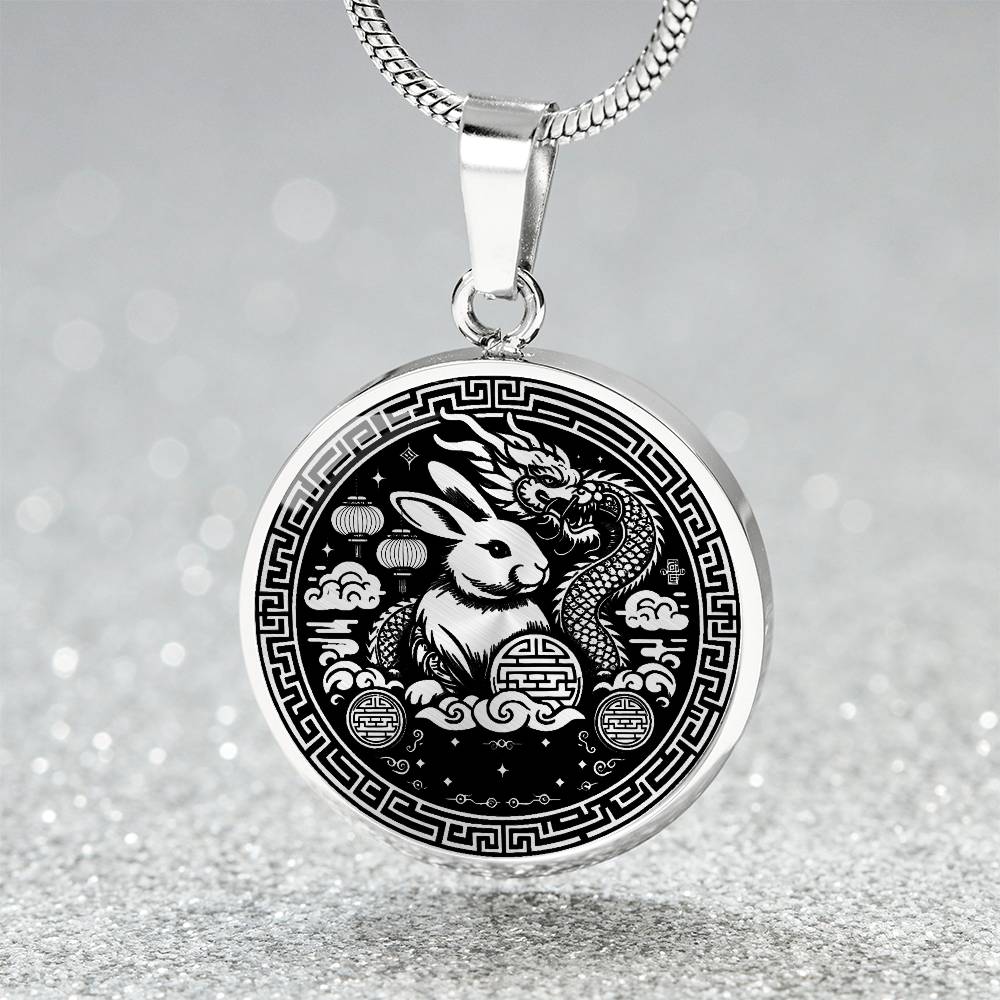 This Year of the dragon necklace. Elegant silver pendant with a rabbit & dragon, is set against a silver backdrop. This jewelry offers personalization with an engraving option for a name.