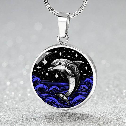 Elegant silver pendant featuring a vivid Silver Dolphin Necklace with a Stars and Blue Ocean Waves set against a silver and black backdrop. This jewelry offers personalization with an engraving option for a name.