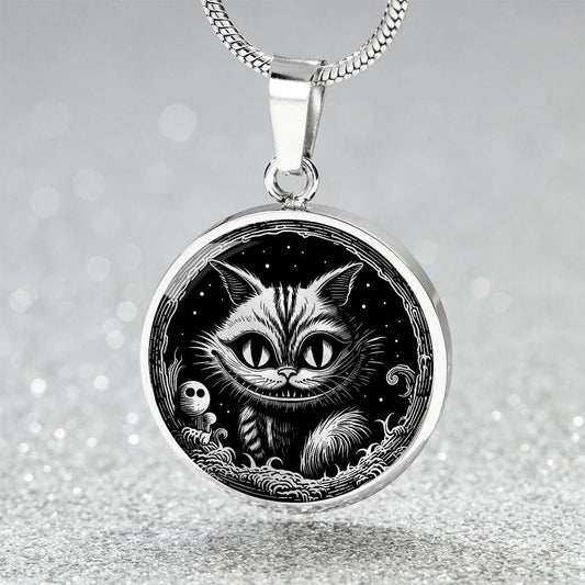 An elegant silver pendant Cheshire Cat Necklace. The colors are gold and black. This necklace offers personalization with an engraving option for a name.