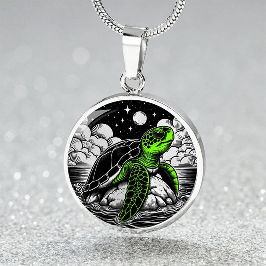 Elegant silver pendant featuring a vivid Green Turtle Necklace with a moon, Stars, Clouds and Ocean set against a black  backdrop. This jewelry offers personalization with an engraving option for a name.